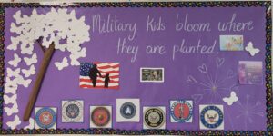 7 fleets logos, tree with white butterflies, American flag, woman blowing dandelion, military child "Military Kids Bloom where they are planted" 