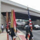 At Freeman Bridge in Arlington, VA; Marine Corp carrying American flag and Marine flag.