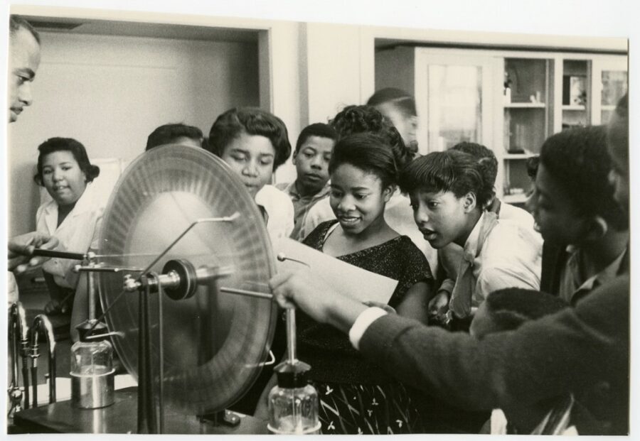 Science-Demonstration-by-George-Melvin-Richardson-Collection-with-Arlington-Library. African American female students looking at science materials.