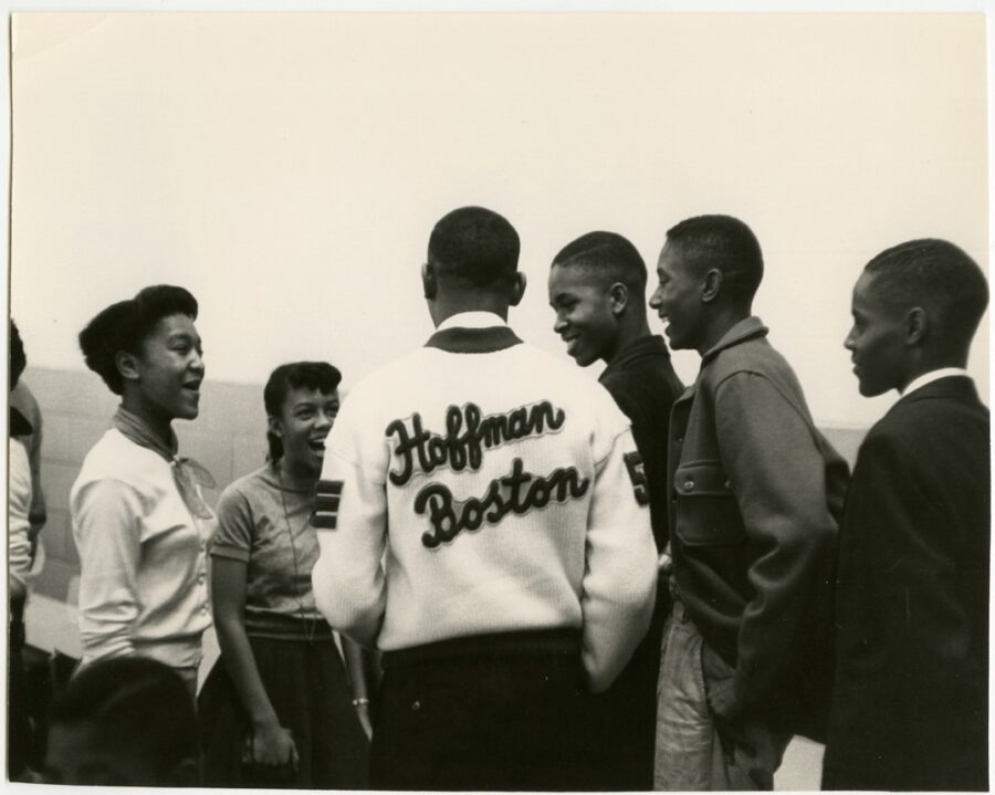 Students-Talking; a man wearing Hoffman Boston shirt