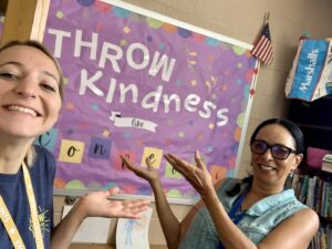 two female teachers "throw kindness"