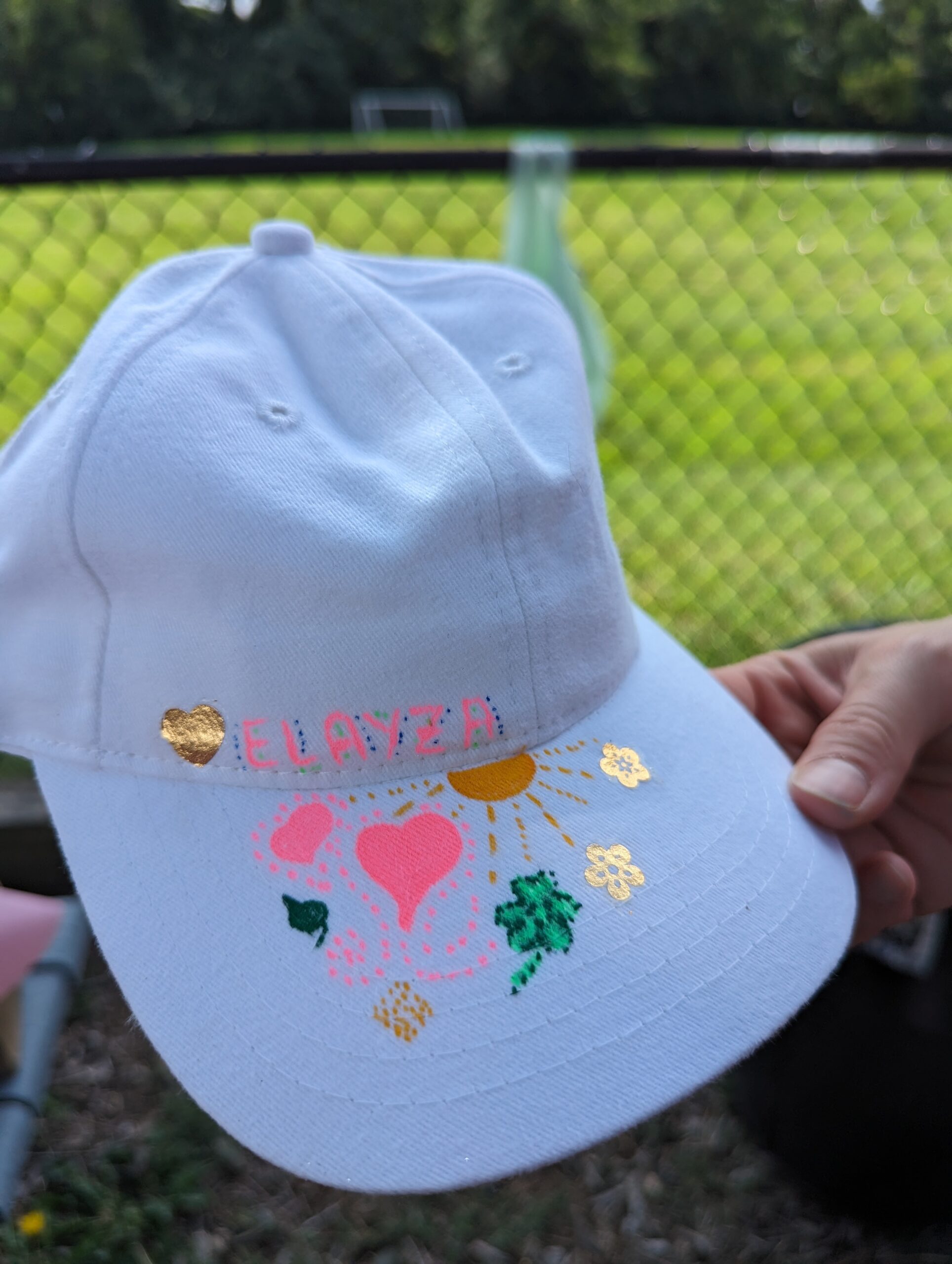 hat with painted heart and star.