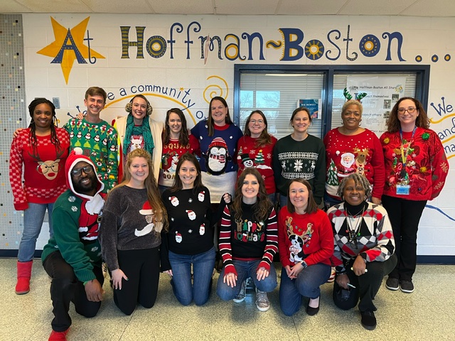 Teachers wearing holiday sweaters.