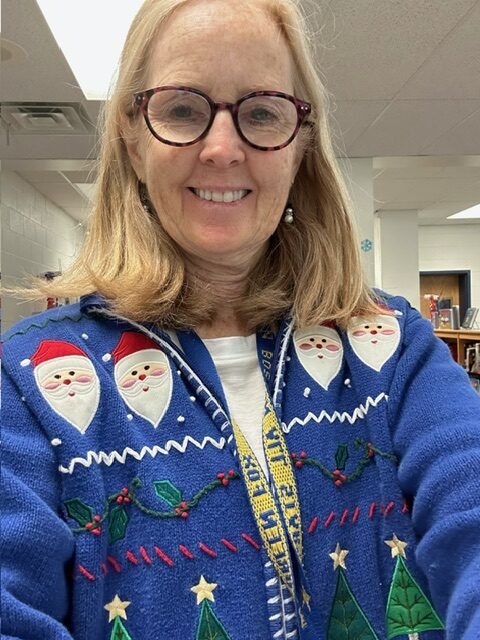Librarian wearing holiday sweater.