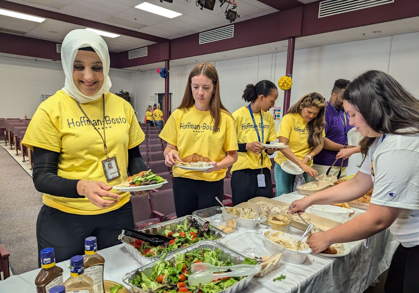 Staff getting food served by PTA for preservice week.