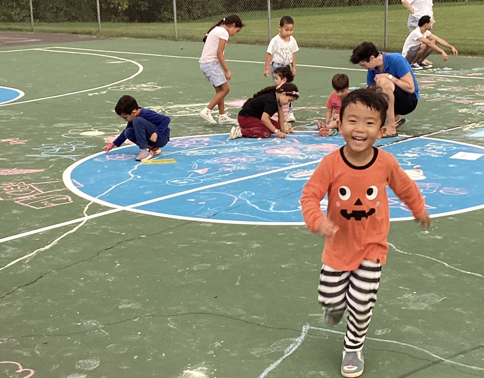 Children played at FACE family playdate at the tennis court.