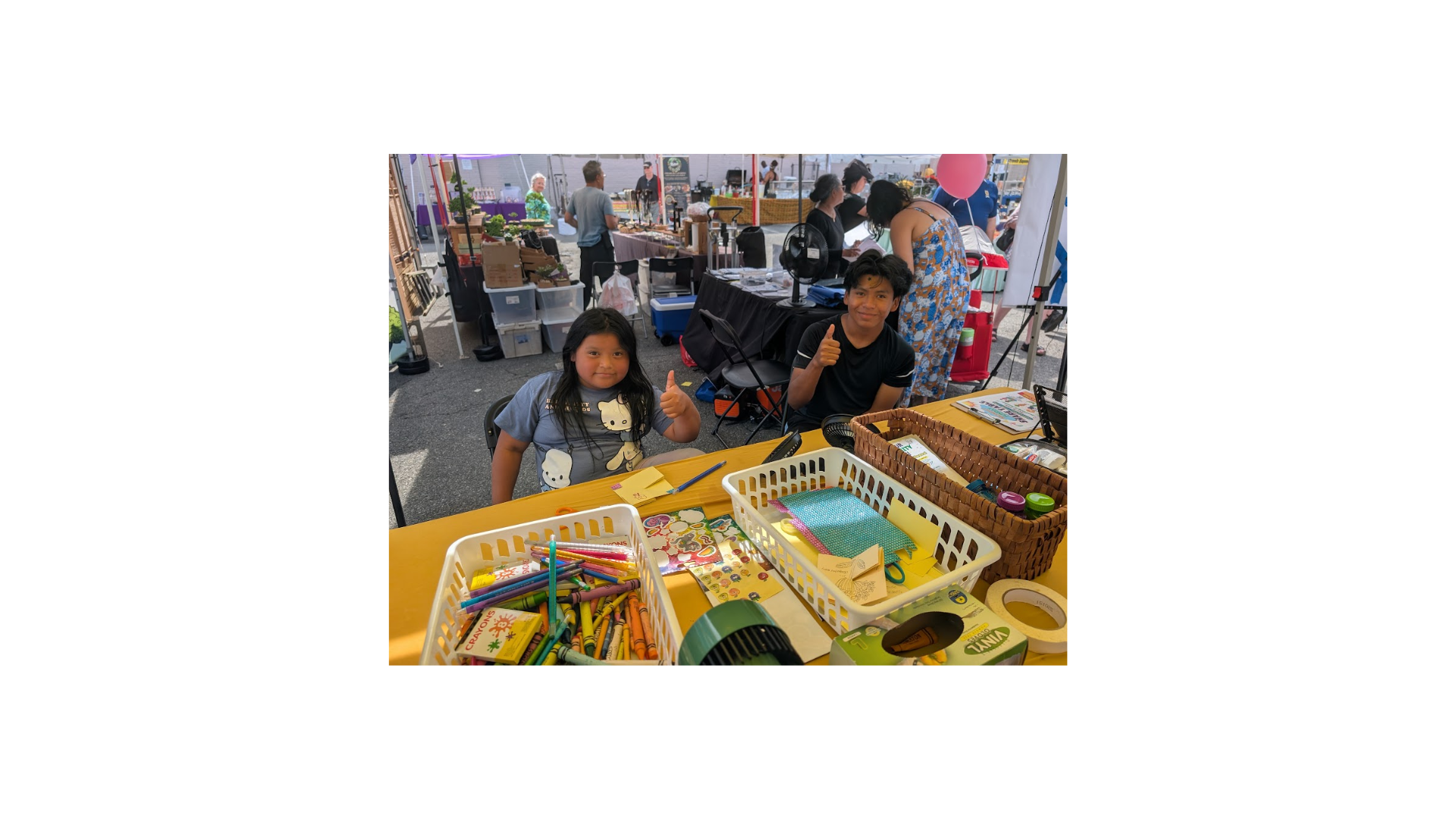 Two students at PTA table